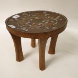 An ethnic stool, inlaid with beads, 26 cm diameter