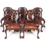 A set of eight 18th century style mahogany dining chairs, with pierced vase shaped splats, leather