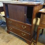 A 19th century mahogany bedside cupboard, with a tambour front above two drawers, 75 cm wide