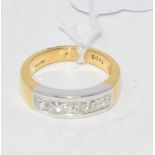 An 18ct yellow gold ring, set five princess cut diamonds in a channel setting, approx. 1.02ct,