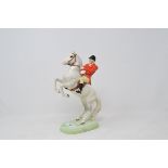 A Beswick huntsman, on a rearing horse, second version, painted white, 868 (minute chip to an ear)