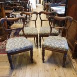 A set of four William IV mahogany dining chairs, on lotus leaf capped front legs (4)