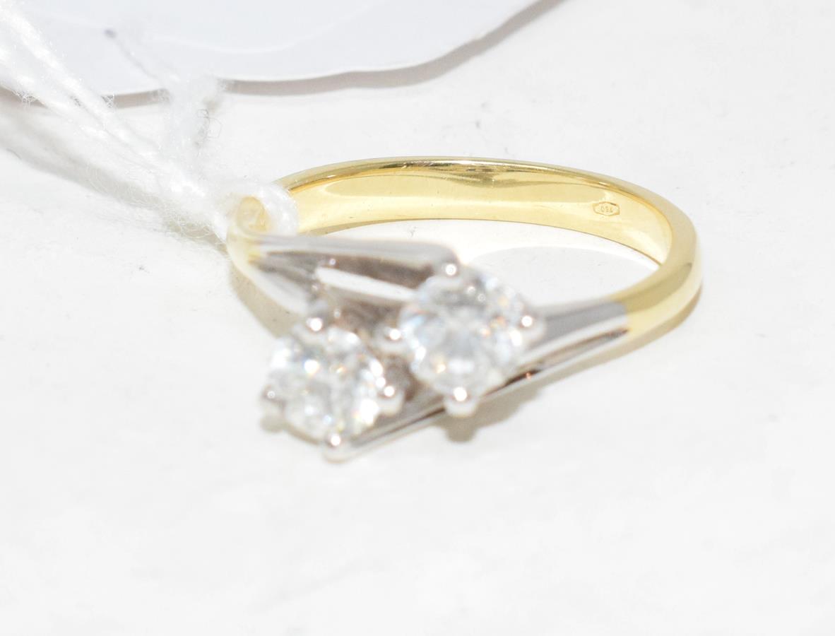 An 18ct gold and two stone diamond fancy crossover ring, diamonds approx. 2.37ct, approx. ring