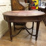 A late Victorian oval mahogany writing table, having a leather inset top, two frieze drawers to