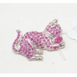 A silver and ruby cat brooch Modern