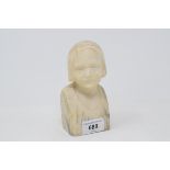 An early 20th century carved marble bust, of a young girl wearing a cap, 14 cm high
