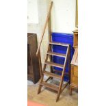 A pair of library oak steps, 48 cm wide Top part of grab rail has been repaired. Some worm to the