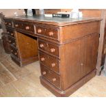 A Victorian oak pedestal desk, the leatherette inset top above an arrangement of nine drawers, 137