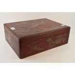 A Japanese lacquered box, decorated a bird of prey, 38 cm wide