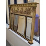 A matched pair of Regency style gilt gesso and painted three plate overmantel mirrors, the ball stud