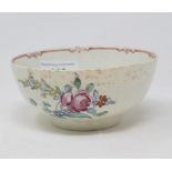 An 18th century English porcelain polychrome bowl, decorated floral sprays, rim chipped, 11.5 cm