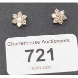 A pair of diamond flowerhead cluster stud earrings, approx. 1.00ct, boxed