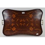 An Art Nouveau inlaid mahogany tea tray, of shaped rectangular form, decorated flowers and