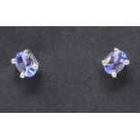 A pair of silver and tanzanite stud earrings, boxed