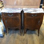 A pair of Louis XVI style serpentine front rosewood bedside cupboards, having marble tops above