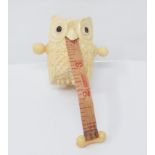 A carved bone owl tape measure Modern