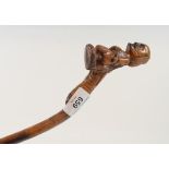 A European (possibly German) folk art walking cane, the handle in the form of a medival man in