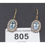 A pair of 9ct gold and silver set blue topaz and pearl earrings Modern