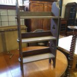 An oak bookcase, with Gothic style pierced sides, 58 cm wide