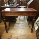 A 19th century mahogany writing table, in the manner of Gillows, the leatherette inset top above a