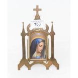 A French arched porcelain plaque, the Madonna, in a Gothic style brass strut frame, 16.5 cm high
