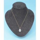 A 9ct gold, blue topaz and diamond pearl shape necklace Modern
