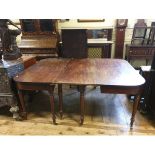 An early 19th century mahogany dining table, inset two extra leaves, on tapering turned legs, 229 cm