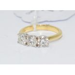 An 18ct yellow gold and three stone diamond ring, diamonds approx. 1.52ct, approx. ring size N½