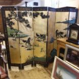 A Japanese six fold screen, decorated horses, trees and mountains, the reverse bamboo and birds, 246