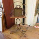 An Aesthetic Period brass and oak magazine rack/music stand