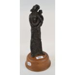 A 20th century bronze study, of a mother and child, on a wooden base, 32 cm high (overall)