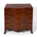 A George III style serpentine front mahogany chest, with boxwood and ebony stringing, having a brush