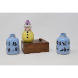 A Robj style porcelain clown night light, and a pair of scent flasks, decorated amusing scenes, 8 cm