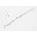 A 9ct white gold and diamond fancy link bracelet