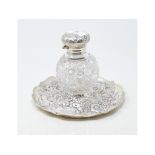 A Victorian silver and cut glass inkwell, embossed flowers and foliage, London 1891, approx. 5.3 ozt