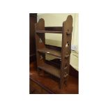 An oak bookcase, with Gothic style pierced sides, 58 cm wide Report by GH A few stains and marks