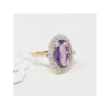 A 9ct gold, amethyst and diamond cluster ring, approx. ring size Q Report by KB Amethyst measures 18