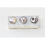 A three section pill box, the lids decorated dogs, 6.5 cm wide Modern