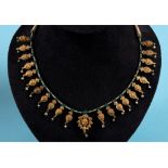 An Indian yellow coloured metal, white sapphire and seed pearl fringe type necklace, decorated