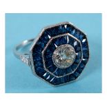 An Art Deco style octagonal platinum, sapphire and diamond ring, the central diamond approx. 0.65ct,