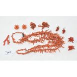 A three strand coral necklace, a pair of coral earrings, and other coral jewellery