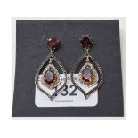 A pair of 14ct gold, silver, garnet and diamond drop earrings