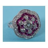 A Victorian style ruby and diamond cluster ring, of shaped circular form, the diamonds approx. 1.