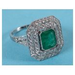 A platinum ring, set an emerald approx. 1.85ct, surrounded by two octagonal halos of diamonds and