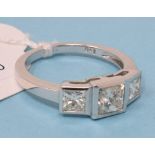 An 18ct white gold and three stone princess cut graduated diamond ring, diamonds approx. 1.60ct,