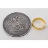 A George III crown, 1819, and a 22ct gold wedding band, approx. 2.6 g (2) Report by PM The size of