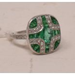 A platinum Art Deco style emerald and diamond panel ring, approx. ring size M½