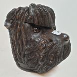 A Black Forest style carved wood tobacco jar, in the form of a dog's head, 19 cm high