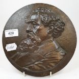 A 19th century bronze plaque, Dickens, signed Bago and dated 1870, 21 cm diameter