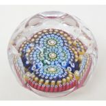 A Whitefriars Millefiore glass paperweight, with faceted sides and cane dated 1972